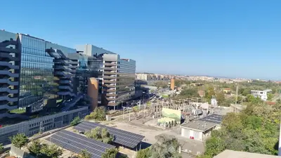 an aerial view of a city with solar panels at BAM BAM TIBURTINA Guesthouse in Rome