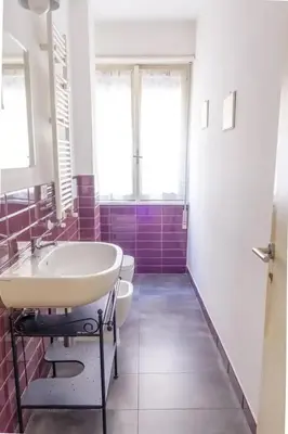 a bathroom with a sink and a toilet at La Casa Di Mamma in Rome