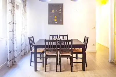 a dining room with a table and chairs at La Casa Di Mamma in Rome