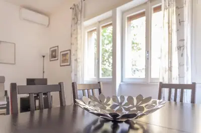 a bowl sitting on top of a wooden table at La Casa Di Mamma in Rome