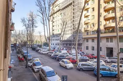 a group of cars parked in a parking lot at La Casa Di Mamma in Rome