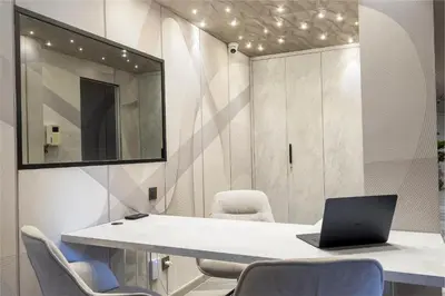 a room with a table with a laptop on it at Tritone Luxury Suites Piazza del Popolo in Rome