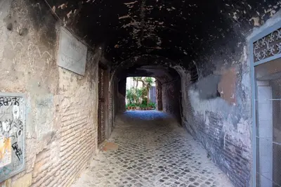 an alley way with a tunnel in an old building at Costaguti Holiday Apartment in Rome