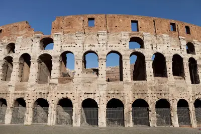 an ancient building with arches in front of it at Costaguti Holiday Apartment in Rome