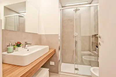 a bathroom with a sink and a shower at Nizza 33 in Rome