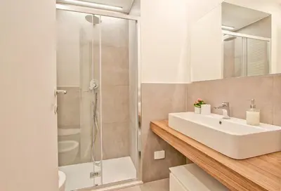 a bathroom with a sink and a shower at Nizza 33 in Rome