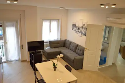 a living room with a couch and a table at Apartment Veio in Rome