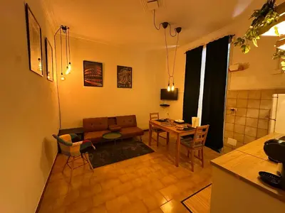 a living room with a couch and a table at ROMA Appia in Rome