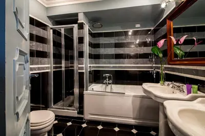 a bathroom with a tub and a sink and a toilet at The Inn at the Spanish Steps Luxury Collection - The View in Rome