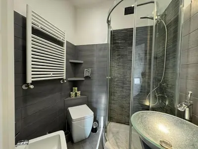 a bathroom with a sink and a toilet and a shower at G&G Apartment in Rome Quadraro in Rome