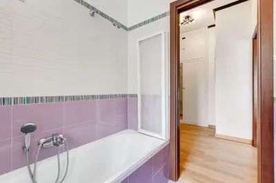a bathroom with a shower with purple tiles at BDC - Rome, Open City! 3-BDR! in Rome