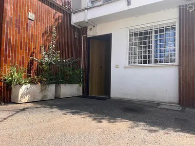 a door to a building with plants next to it at StudioFlat Battistini in Rome