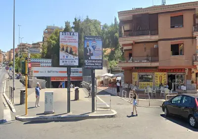 a group of people walking on a street with signs at StudioFlat Battistini in Rome