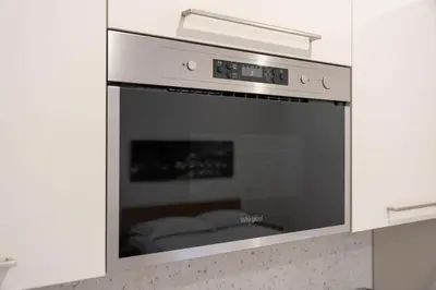 a kitchen with an oven in a white kitchen at When in Rome in Rome
