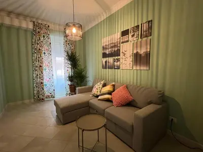 a living room with a couch and a table at Maison Roberto in Rome