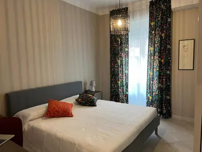 a bedroom with a bed with two pillows on it at Maison Roberto in Rome