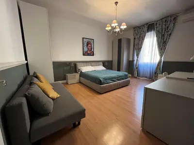 a living room with a bed and a couch at Veniero Apartment in Rome