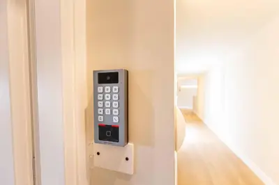 a remote control sticking out of a door at LUMINA3 Luxury Room ROME in Rome