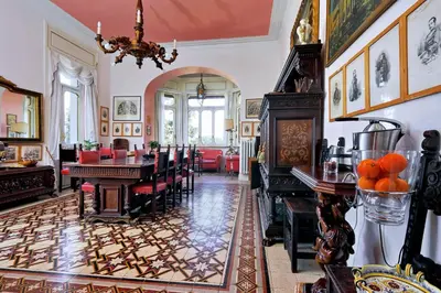 a dining room with a table and chairs at Domus Monamì Luxury Suites in Rome