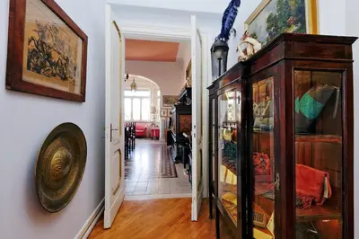 a room with a wooden cabinet and a hallway at Domus Monamì Luxury Suites in Rome