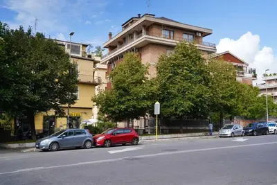 a group of cars parked on the side of a street at Villa Bonelli Penthouse in Rome