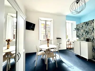 a dining room with a table and chairs at Pina Charme in Rome