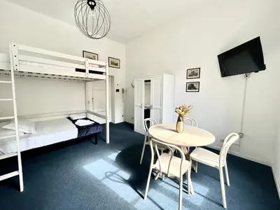 a room with a table and a bunk bed at Pina Charme in Rome