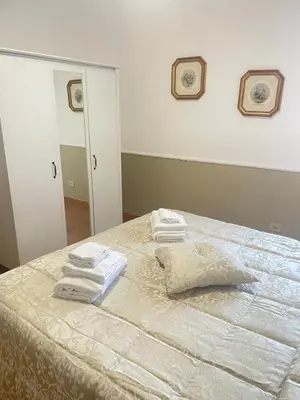 a bedroom with a bed with towels on it at Sweet home Trastevere 2- Roma in Rome
