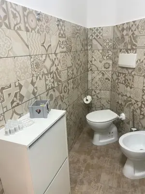 a bathroom with a toilet and a sink at Sweet home Trastevere 2- Roma in Rome