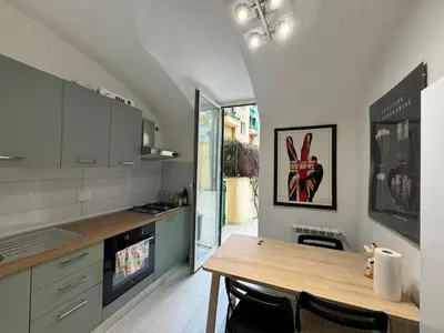 a kitchen with a wooden table in a room at Quiet Corner in the Eternal City in Rome