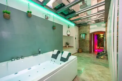a large bathroom with a large tub in a room at Casa Cristallo Relax e Spa in Rome