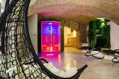 a room with a red and purple door and chairs at Casa Cristallo Relax e Spa in Rome