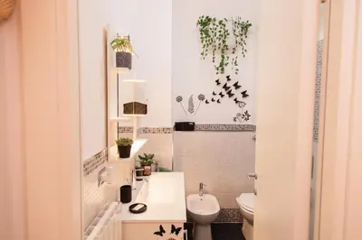 a bathroom with a toilet and a sink at Stefy's House in Rome