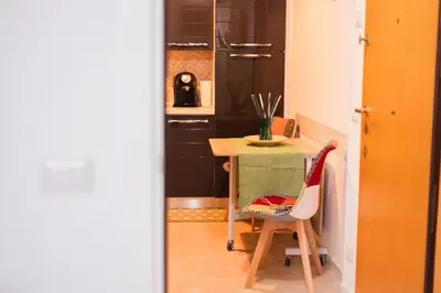 a small kitchen with a table and a chair at Stefy's House in Rome