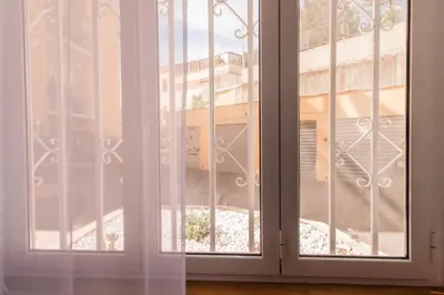 an open window with a view of a building at Stefy's House in Rome