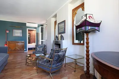 a living room filled with furniture and a fireplace at Spagna Prestige Apartment in Rome