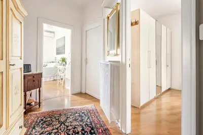 a room with a hallway with a rug on the floor at Vatican Penthouse 1 by Almond Tree in Rome