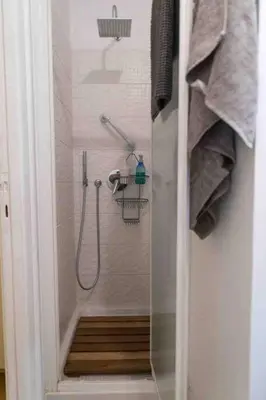 a shower in a bathroom with a glass door at Vatican Penthouse 1 by Almond Tree in Rome