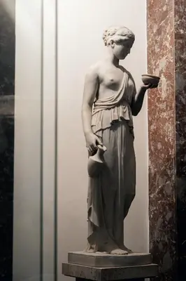 a statue of a woman holding a bowl at The Rubens Collection in Rome