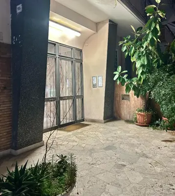 a dining room with a table and chairs at casa di Francesca in Rome