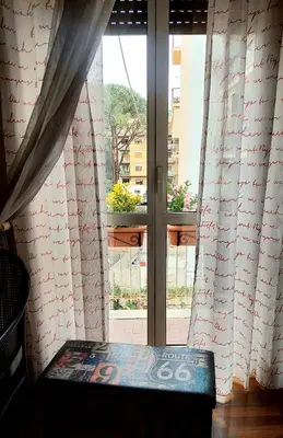 a dining room with a table and chairs in a room at casa di Francesca in Rome