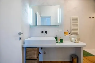 a kitchen with a wooden table in a room at Properzio 37 in Rome