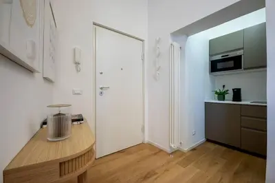 a bathroom with a clock on a wall at Properzio 37 in Rome