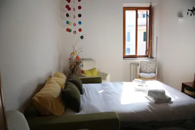 a bedroom with a large bed in a room at Casa del Drago in Trastevere in Rome