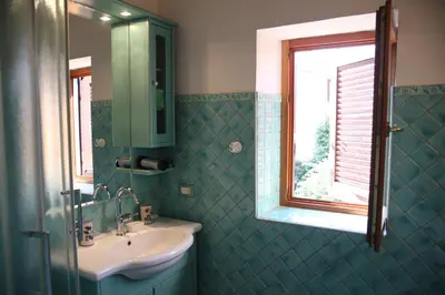 a bathroom with a sink and a window at Casa del Drago in Trastevere in Rome