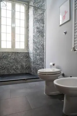a bathroom with a toilet and a sink at Artist Vatican House in Rome