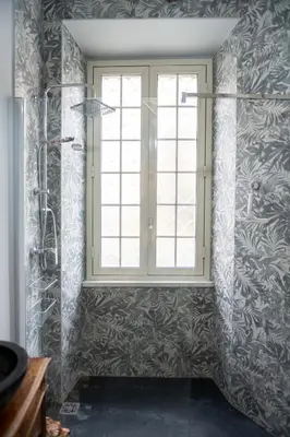 a bathroom with a window and a shower at Artist Vatican House in Rome