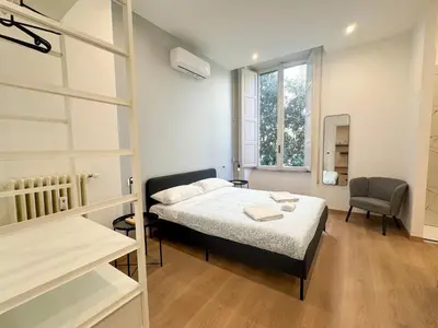 a small room with a bed and a window at Montezebio Boutique Rooms in Rome