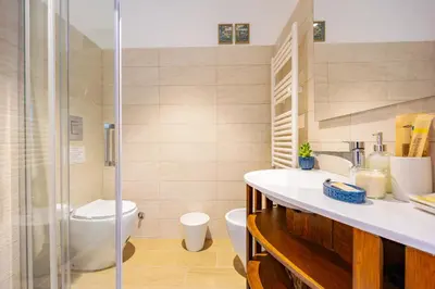 a bathroom with a toilet and a sink and a shower at Luminosa camera con bagno privato interno - vicina alla metro in Rome
