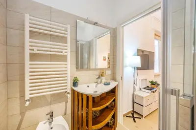 a bathroom with a sink and a mirror at Luminosa camera con bagno privato interno - vicina alla metro in Rome